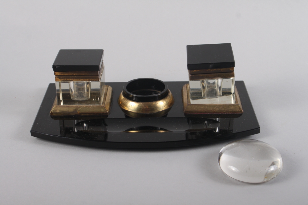 A 1930s black glass desk inkstand, 11" wide (two feet missing) and a desk weight