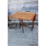 An Edwardian walnut Sutherland table, on turned and stretchered supports, 24" wide x 29" deep x