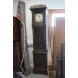 An Arts & Crafts design oak long case clock with silvered dial, Arabic numerals and chapter ring,