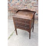 An Edwardian walnut three-drawer music cabinet, on square taper supports, 21" wide x 15" deep x 28