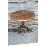 An early 19th century mahogany circular tilt top occasional table, 32" dia x 28" high (one leg