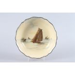 A Royal Doulton fruit bowl, decorated sailing boats on a yellow ground, 9 1/2" dia