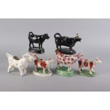 Six 19th century and later model cow creamers, including a German cow creamer with floral