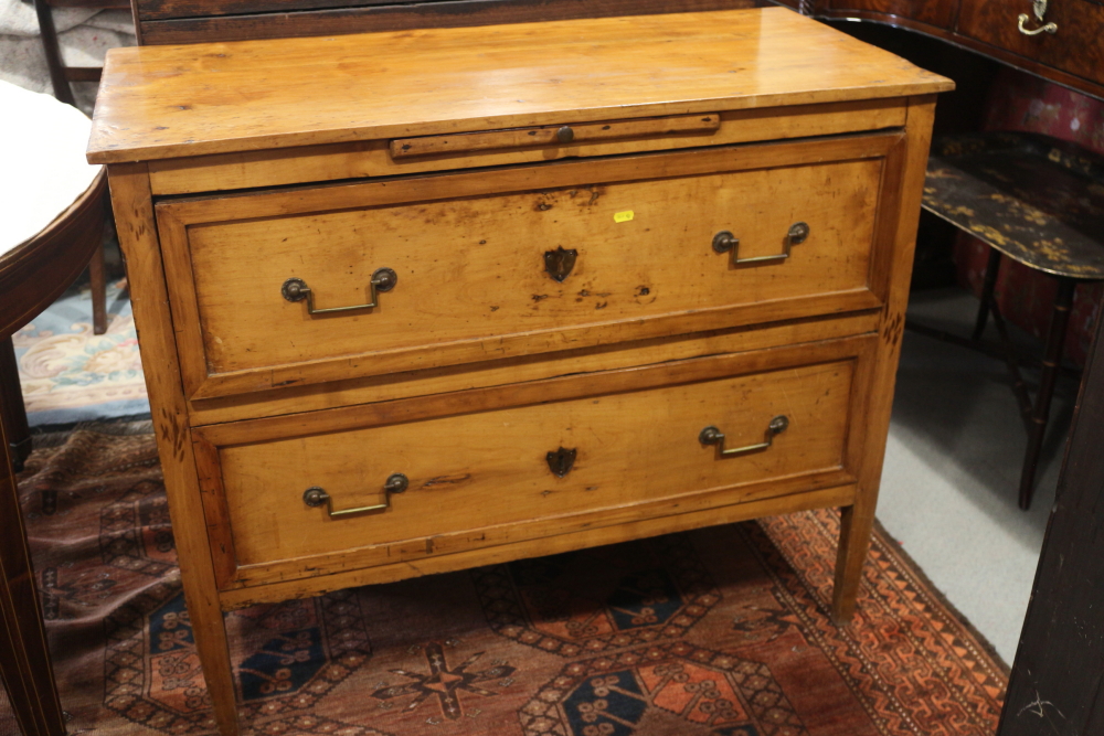 A 19th century French provincial fruitwood commode, fitted slide over two drawers, on square taper