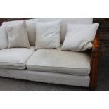 A modern hardwood double bergere three-seat settee with loose seat and back cushions
