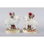 A pair of 19th century Staffordshire sheep spill vases, 7 1/4" high (damages)