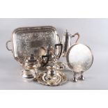 A silver plated coffee pot, a matching teapot, a two-handled plated tray, 22" wide, a gravy boat and
