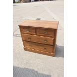 A satin walnut chest of two small and two long drawers, on block base, 36" wide x 17" deep x 32"