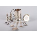 A silver mug with engraved initials, 4" high, a pair of salt shakers, two salt spoons, a pair of
