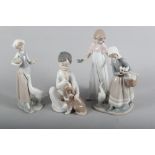 Three Lladro figure groups, girl with basket of ducklings, 9" high, girl with goose, 9 1/2" high,