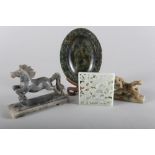A Chinese pale celadon jade plaque, decorated dragon and clouds, 2 7/8" square, two soapstone