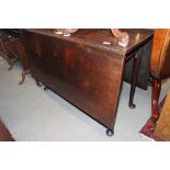 An 18th century mahogany drop leaf Sutherland dining table, on turned supports, 41" wide