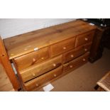 A waxed pine chest of three small and four large drawers, on block base, 51" wide x 17" deep x 29"