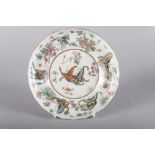 A Chinese porcelain famille verte dish, decorated butterflies and flowers with seal mark to base,