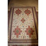 An Aztec style rug with animal and geometric designs, 62" x 46" approx