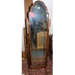 A cheval dressing mirror with shaped top