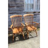 A pair of 19th century Windsor lath back kitchen armchairs