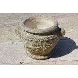 A cast stone planter, decorated chariots, 16" dia x 16" high