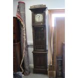 An Arts & Crafts design oak long case clock with silvered dial, Arabic numerals and chapter ring,