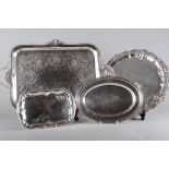 A silver plate on copper two-handled tea tray, 24" across, two other plated trays and an oval dish