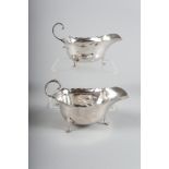 A pair of silver sauce boats with scrolled handles, 5oz troy approx