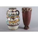 An Iberian slip decorated two-handled vase with floral and animal decoration, 16" high (restored),