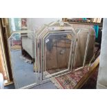 A triple-plate dressing table mirror with cream and gilt frame