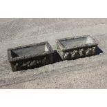 A cast stone rectangular planter with swag decoration, 23" wide x 8" high, and another similar