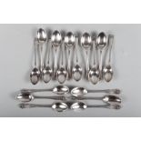 A set of six silver teaspoons with gadrooned borders and eleven other silver teaspoons, 8.1oz troy