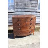 An early 19th century bowfront mahogany chest of two short and three long drawers, 42" wide