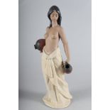 A Lladro Gres figure of a semi-nude woman, "Water Carrier" No 2323, 14" high, in box