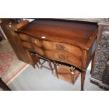 A Georgian design serpentine fronted side table, fitted four drawers, 42" wide