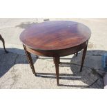 A 19th century mahogany and ebony strung two-section extending dining table with two extra leaves,