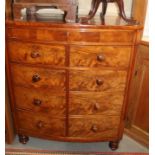 A mahogany bowfront linen chest, fitted three drawers over cupboards enclosed faux drawer fronts