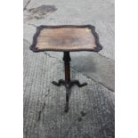 A 19th century carved rosewood shape top occasional table, on cluster column and tripod splay