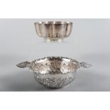 A silver bowl with lobed decoration and an embossed silver two-handled bowl, 7.5oz troy approx