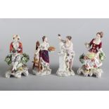 A pair of Chelsea style seated figures, 5" high, and two Continental porcelain muses, 5" high