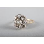 A yellow metal and diamond "daisy" ring