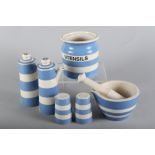 A T.G. Green Cornishware blue and white utensils jar, 5 1/4" high, a pair of similar oil and vinegar