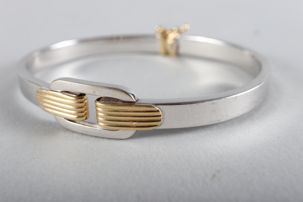 An Italian 18ct white gold bangle with yellow gold details, 15.6g