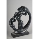 An Austin Sculpture bronzed figure of a stylised three-quarter length nude in a wave, 17" high