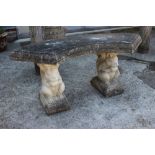 A pair of cast stone curved garden benches, formed as squirrels, on supports, 40" wide x 17" high