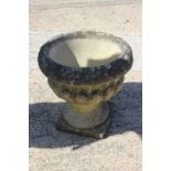 A cast stone urn, 14" dia x 15" high