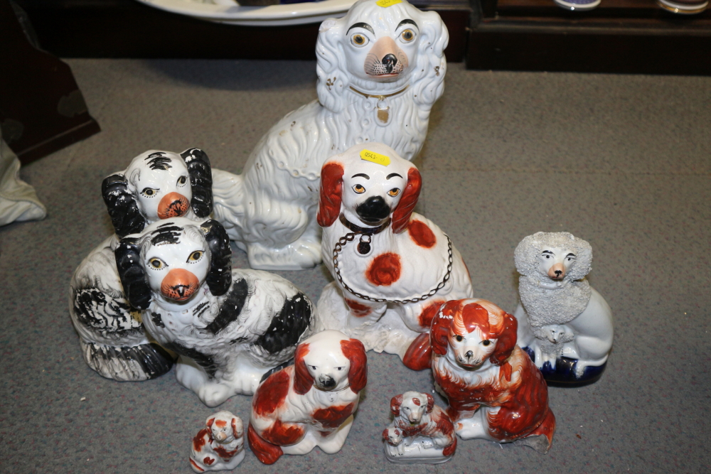 A pair of 19th century Staffordshire seated spaniel models and seven similar Staffordshire dog