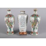 A pair of Chinese porcelain famille verte baluster vases, decorated figures, 10 1/2" high (