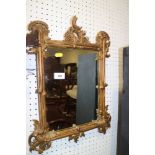 A late Victorian carved giltwood mirror, 12" x 9"