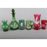A "Mary Gregory" green decanter with figure decoration, 8 1/2" high, a similar jug and tumbler and a