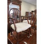 A set of eight 19th century mahogany splat back dining chairs, upholstered in a cream fabric, on