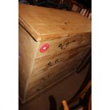 A 19th century stripped pine chest of two short and three long drawers with brass loop handles,