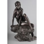 An Elton cold cast bronze figure of a nude on a rock, 16" high